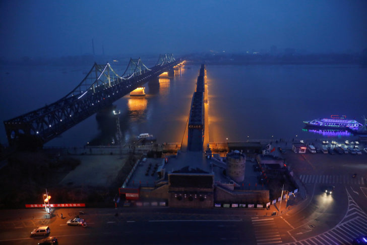 FILE PHOTO: Lights are turned on on the Friendship and the Broken bridges over the Yalu River