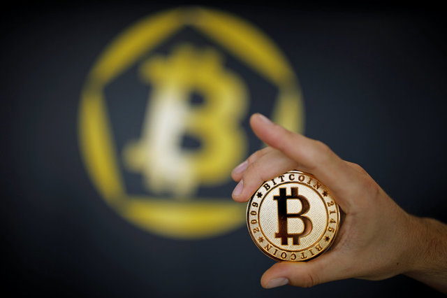 A Bitcoin (virtual currency) coin is seen in an illustration picture taken at La Maison du Bitcoin in Paris