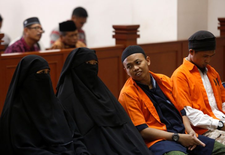 Dian Yulia Novi stands trials in a court in Jakarta