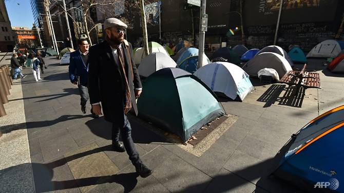 commuters-pass-by-tents-set-up-in-martin-place-1501661992945-3