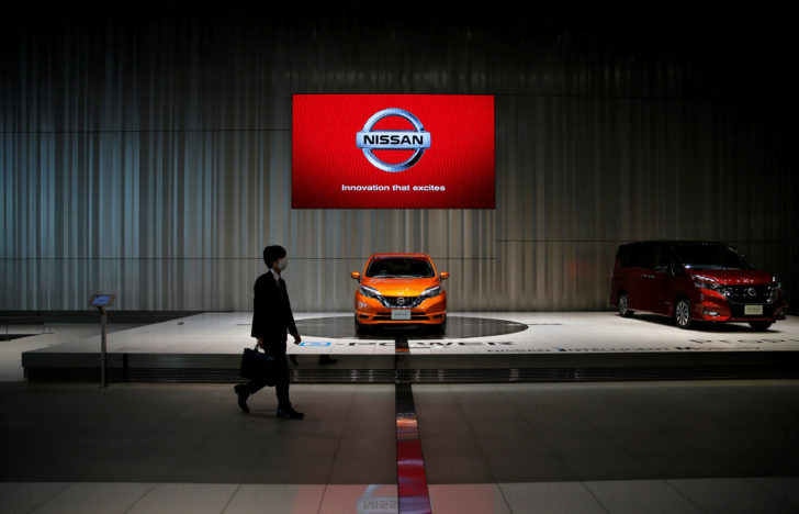FILE PHOTO : A man walks in the Nissan showroom at the carmaker's headquarters in Yokohama