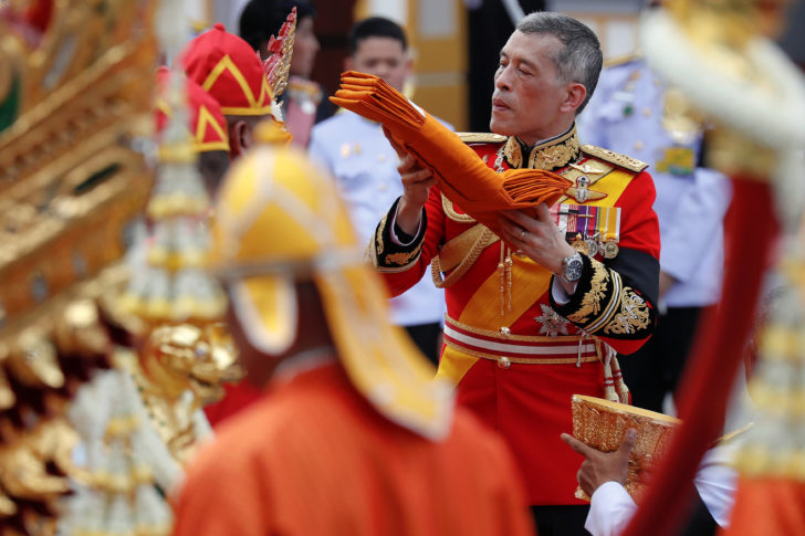 Thailand's King Maha Vajiralongkorn takes a part in the royal cremation procession of late King Bhumibol Adulyadej at the Grand Palace in Bangkok