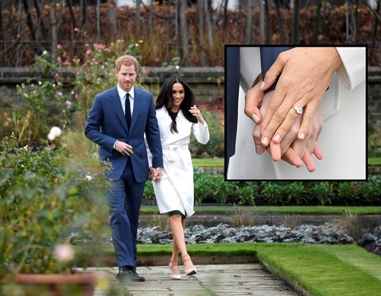 Britain's Prince Harry walks with Meghan Markle in the Sunken Garden of Kensington Palace
