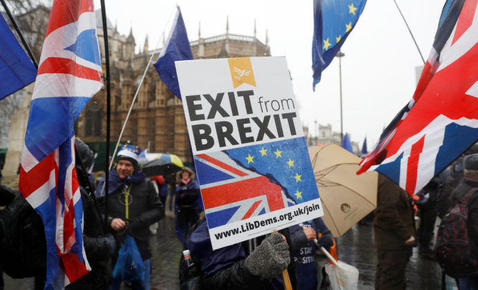 Anti Brexit protesters demonstrate outside the Houses of Parliament in London