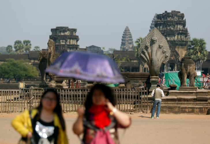 Tourists visit the Angkor Wat temple complex in Siem Reap