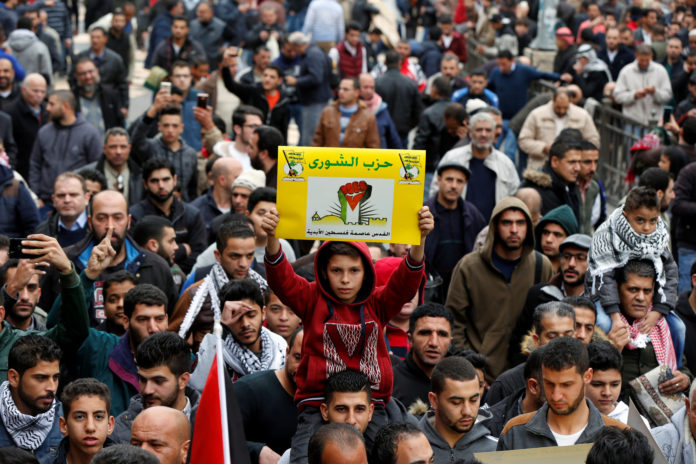 People protest against U.S. President Donald Trump's recognition of Jerusalem as Israel's capital, in Amman