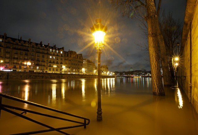 A street lamp is seen on the flooded banks of the River Seine in Paris