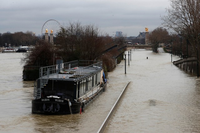 A view shows a peniche boat moored along the flooded banks of the River Seine after days of almost non-stop rain caused flooding in the country in Paris