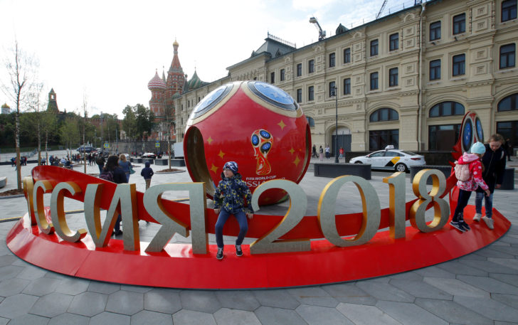 FILE PHOTO: People gather near decorations for the upcoming 2018 FIFA World Cup in central Moscow