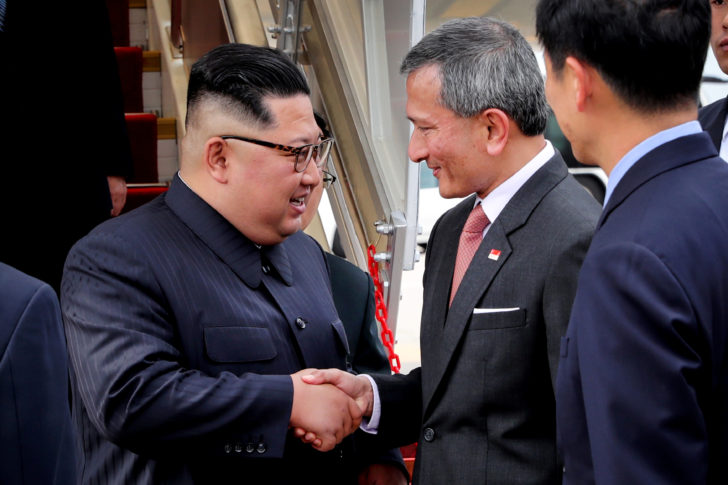 North Korea's leader Kim Jong Un shakes hands with Singapore's Foreign Minister Vivian Balakrishnan after arriving in Singapore