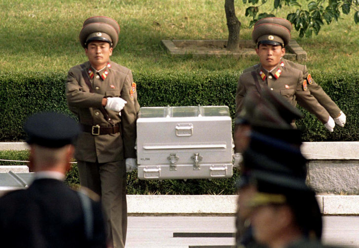 FILE PHOTO: North Korean soldiers carry coffin to the border with South Korea during repatriation ceremonies in Panmunjom, South Korea