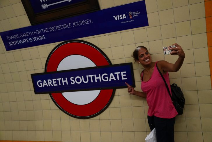A passenger takes a selfie at Southgate Underground Station, temporarily renamed as 'Gareth Southgate' in honour of England soccer team manager Gareth Southgate, is seen in London