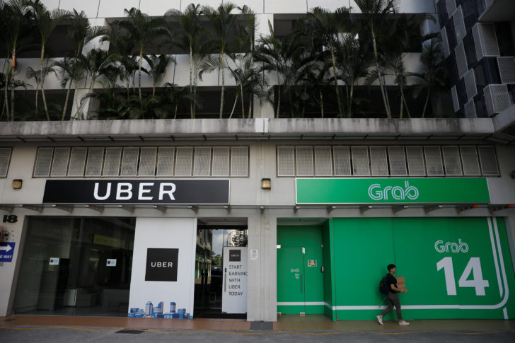 A view of Uber and Grab offices in Singapore “สิงคโปร์” เสนอให้ปรับ “อูเบอร์-แกร็บ” หลังควบรวมกิจการ กระทบรูปแบบการแข่งขันในปท.