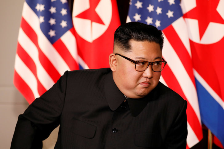 North Korea's leader Kim Jong Un looks at U.S. President Donald Trump before their bilateral meeting in Singapore