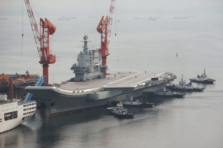 China's first domestically developed aircraft carrier departs the port for its second sea trial in Dalian, Liaoning