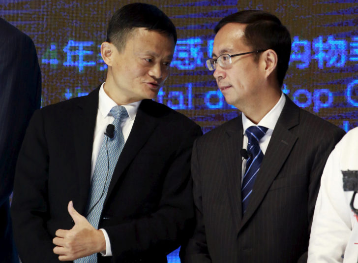 FILE PHOTO: Alibaba Founder and Chairman Jack Ma talks to CEO Daniel Zhang at NYSE Bell Ringing ceremony during Alibaba Group's 11.11 Global shopping festival in Beijing
