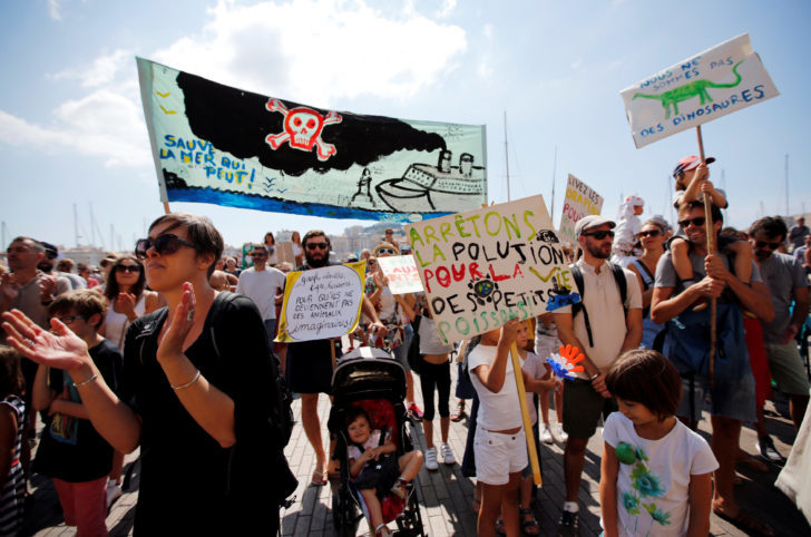 Environmental activists gather to urge world leaders to take action against climate change in Marseille