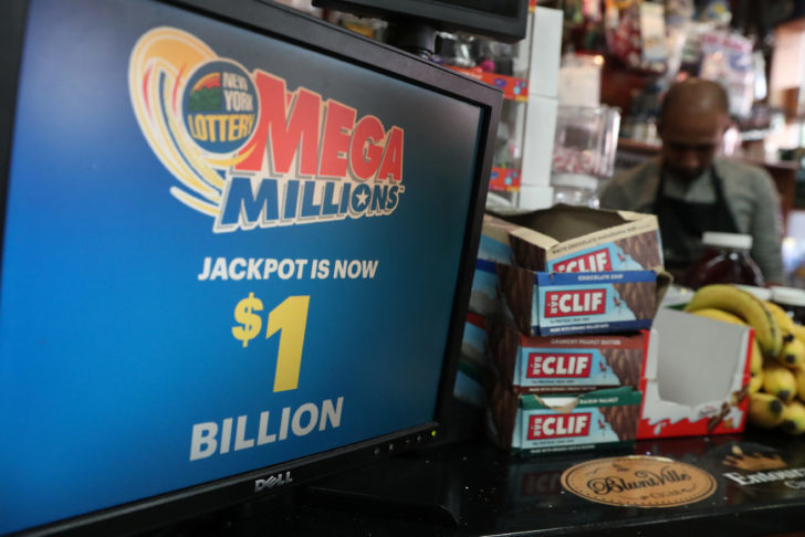 A sign advertising tickets for the $1-billion Mega Millions lottery drawing is seen in Brooklyn, New York