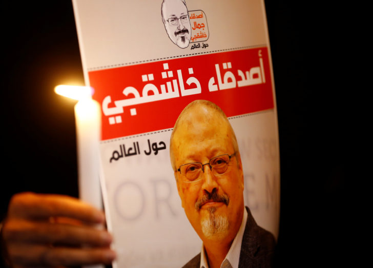 A demonstrator holds a poster with a picture of Saudi journalist Jamal Khashoggi outside the Saudi Arabia consulate in Istanbul