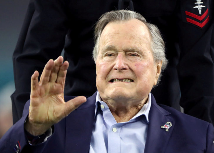 FILE PHOTO: Former U.S. President George H.W. Bush arrives on the field ahead of the start of Super Bowl LI in Houston