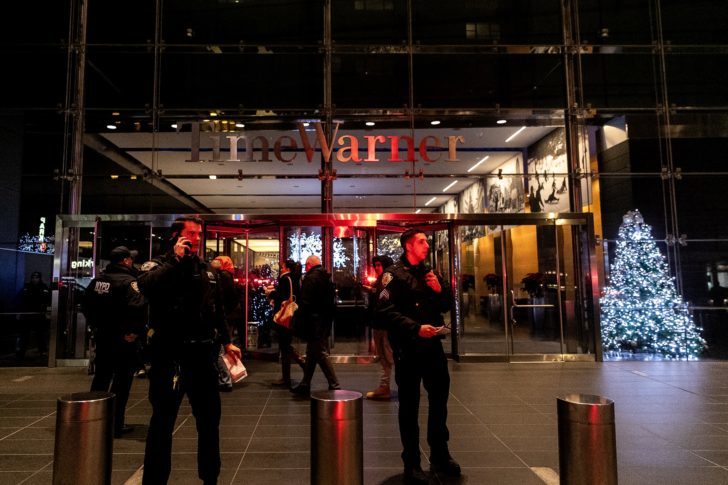 NYPD officers stand near the Time Warner Center Building after the building was evacuated due to a bomb threat, in the Manhattan borough of New York City