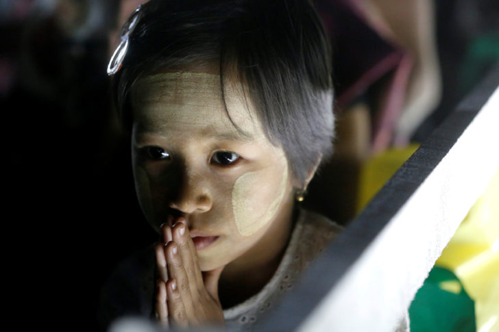 People attend the New Year prayer in Yangon