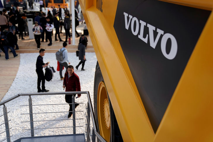 FILE PHOTO - People visit heavy machinery of Volvo at Bauma China, the International Trade Fair for Construction Machinery in Shanghai