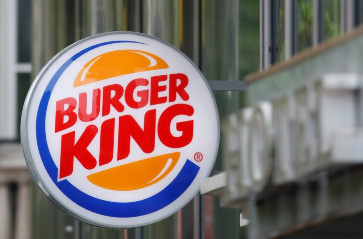 Logos of fast food chains McDonald's and Burger King are seen in front of their restaurants in Paris