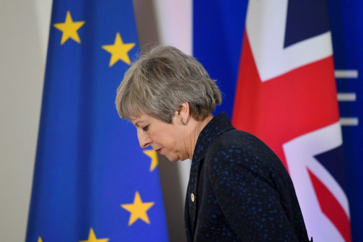 FILE PHOTO: Britain's PM Theresa May leaves after giving a news briefing in Brussels
