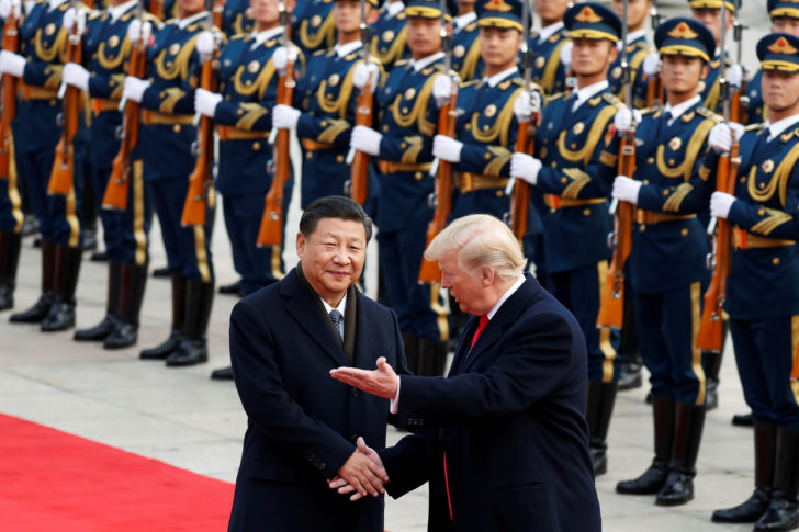 FILE PHOTO: U.S. President Donald Trump takes part in a welcoming ceremony with China's President Xi Jinping in Beijing