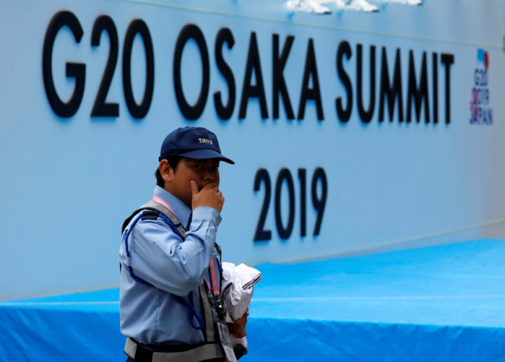 A security officer walks past at the venue of G20 leaders summit in Osaka, western Japan