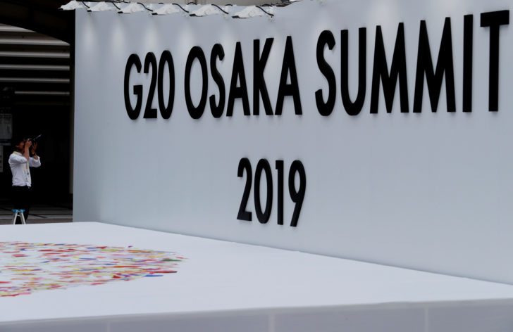 A photographer takes a photo at G20 leaders summit venue in Osaka