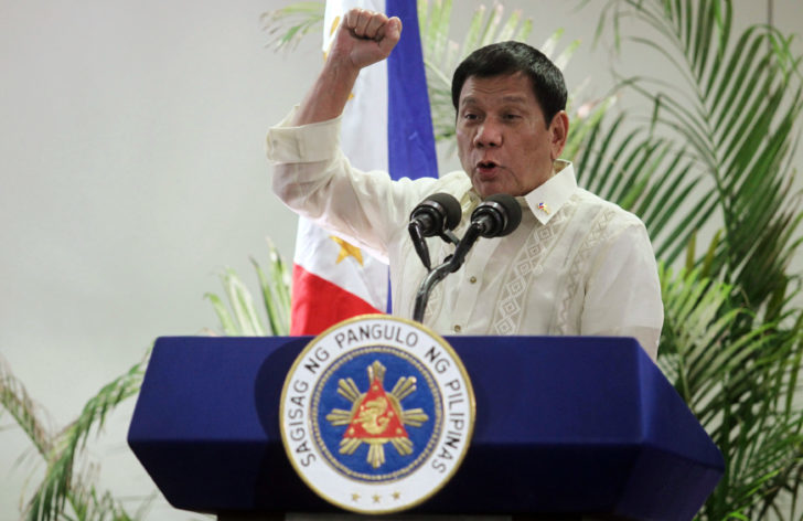 Philippine President Rodrigo Duterte speaks after arriving from Malaysia, at Davao International airport in Davao