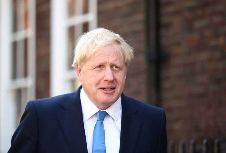Boris Johnson is seen outside his office in London