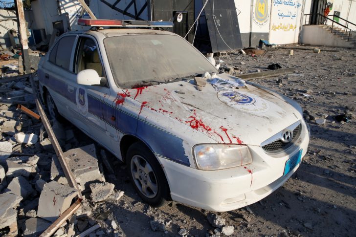 Blood stains are seen on a police car at a detention centre for mainly African migrants, hit by an airstrike in the Tajoura suburb of Tripoli