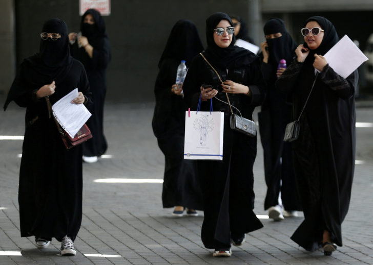 FILE PHOTO: Saudi students walk at the exhibition to guide job seekers at Glowork Women's Career Fair in Riyadh