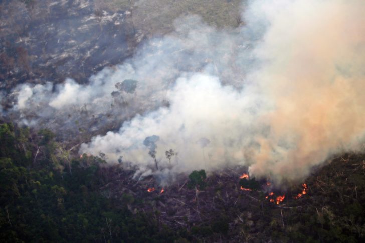 Smoke billows during a fire in an area of the Amazon rainforest near Porto Velho, Rondonia