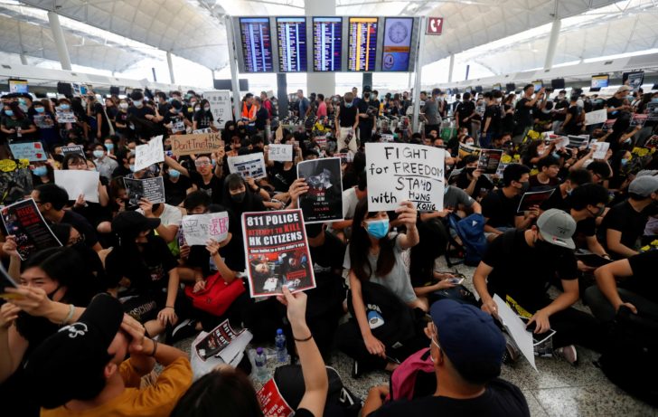 Anti-extradition bill demonstrators attend a protest at the departure hall of Hong Kong Airport