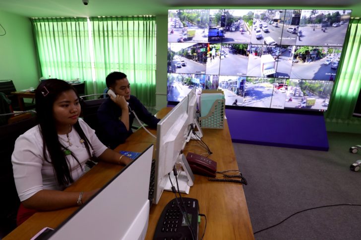 Staff members work at the technology control centre at Mandalay City Development Committee headquarters in Mandalay