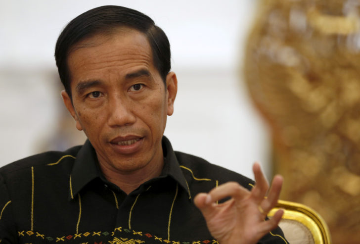 FILE PHOTO: Indonesian President Joko Widodo gestures while speaking with Reuters during an interview at the presidential palace in Jakarta, Indonesia
