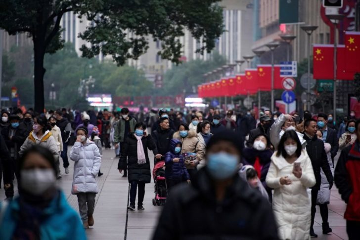 People wear at the Nanjing Pedestrian Road, a main shopping area, in Shanghai