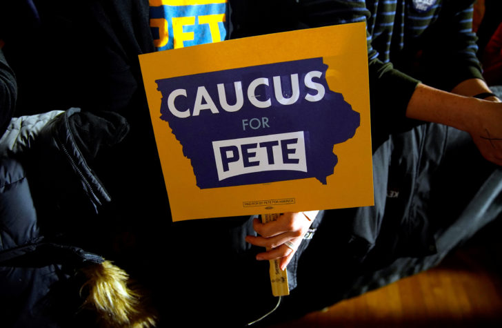FILE PHOTO: A person holds a sign in support of Democratic presidential candidate former South Bend, Indiana mayor Pete Buttigieg at his Caucus night rally in Des Moines,