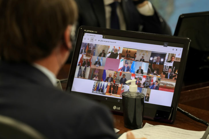 Brazil's President Bolsonaro takes part in video link, held by G20 leaders in Brasilia