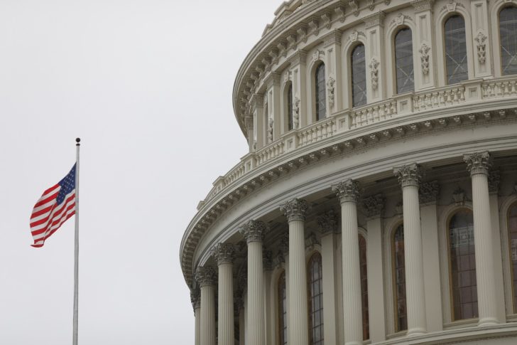 FILE PHOTO: The U.S. Capitol during a morning rainstorm, after Congress agreed to a multi-trillion dollar economic stimulus package created in response to the economic fallout from the COVID-19 Coronavirus, on Capitol Hill in Washington
