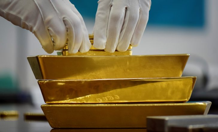 FILE PHOTO: An employee places gold bars in the Kazakhstan National Bank vault in Almaty