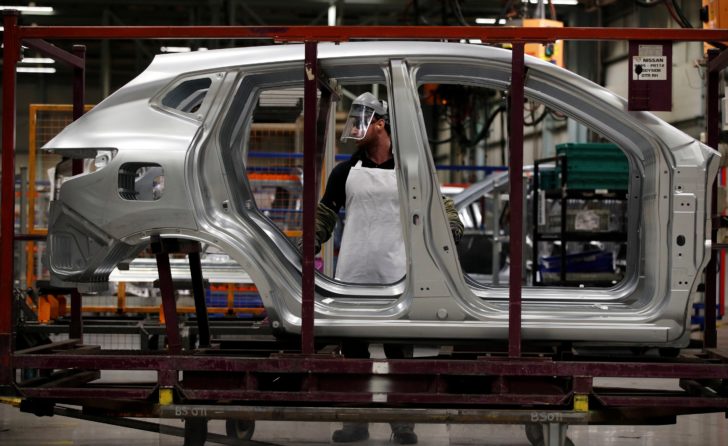 FILE PHOTO: Workers are seen on the production line at Nissan's car plant in Sunderland Britain