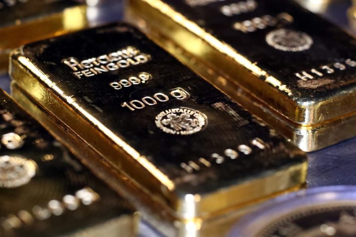 FILE PHOTO: Gold bars and coins are stacked in the safe deposit boxes room of the Pro Aurum gold house in Munich