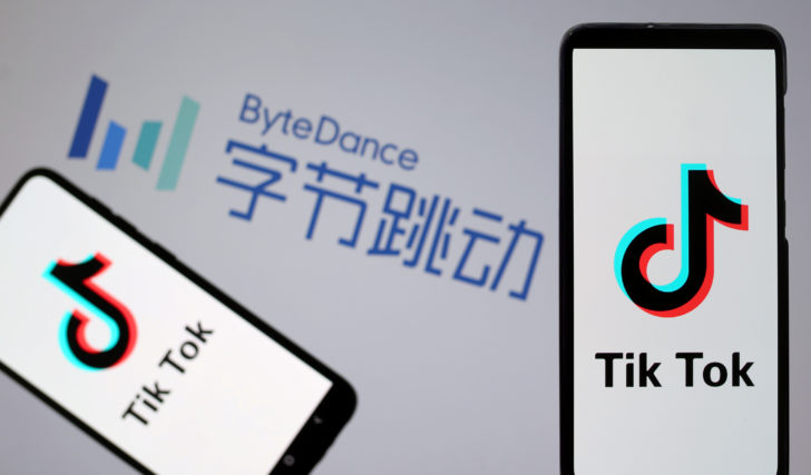 FILE PHOTO: TikTok logos are seen on smartphones in front of displayed ByteDance logo in this illustration