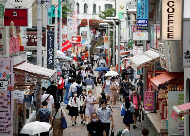 Passersby wearing protective face masks are seen at Takeshita Street, a popular sightseeing spot amid the coronavirus disease (COVID-19) outbreak in Tokyo