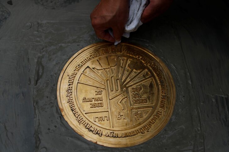 Student leaders install a plaque declaring